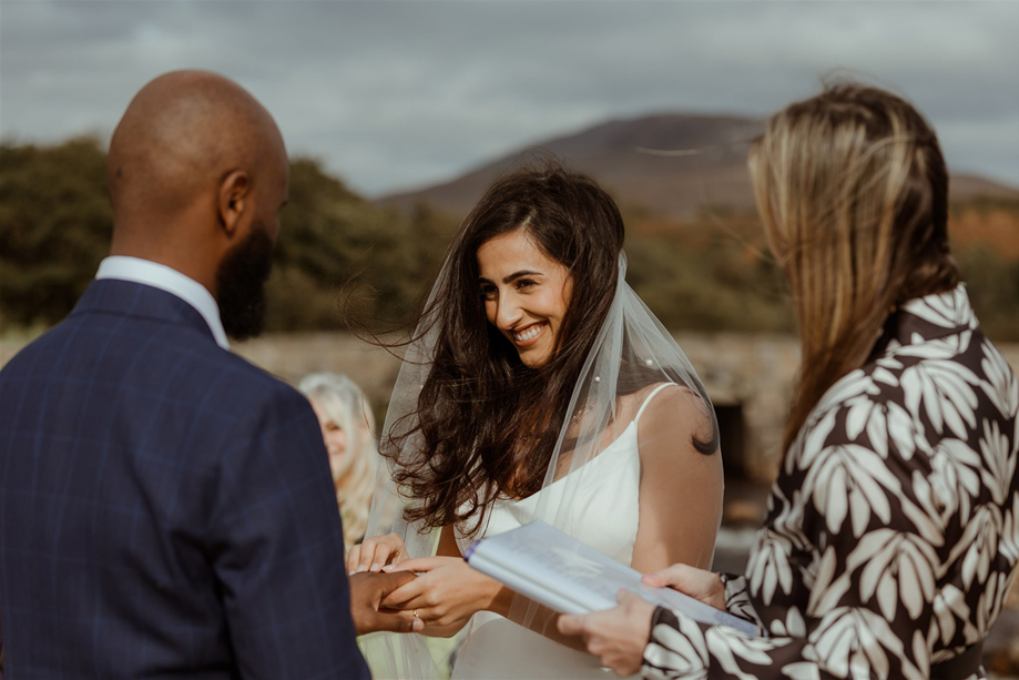 A Bride And Groom Exchange Rings On Arran Beach