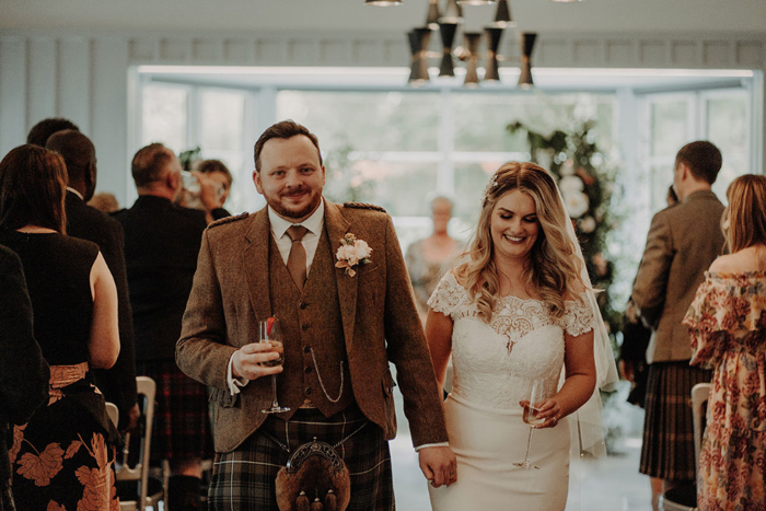 Bride and groom walking down aisle