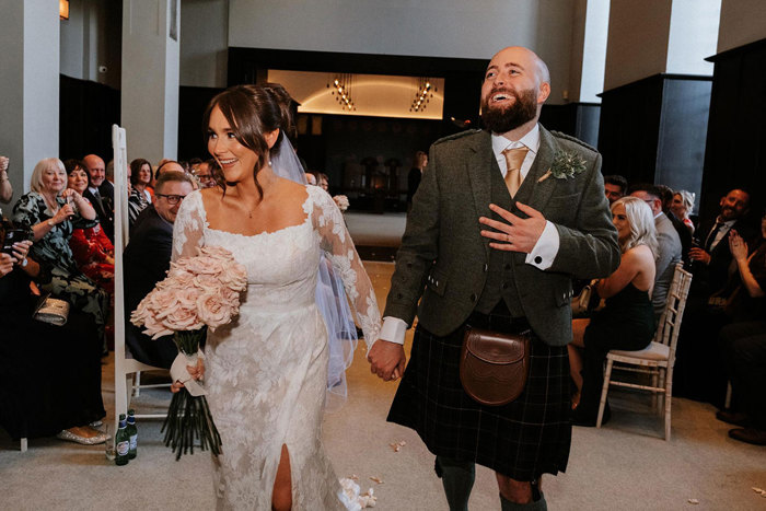 Bride and groom leaving ceremony 