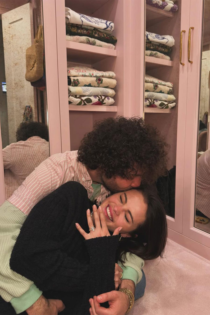 Selena Gomez and Benny Blanco engagement announcement photo with the pair embracing and smiling