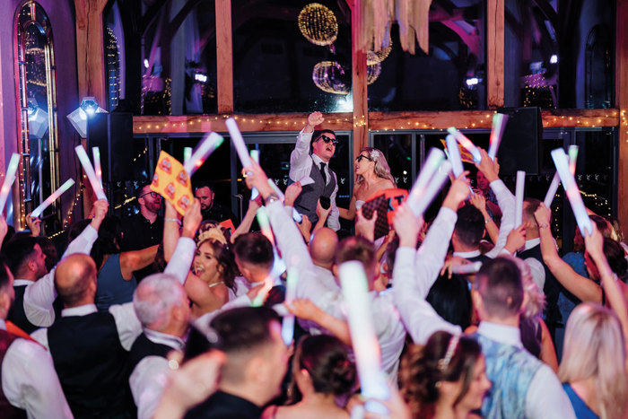 Couple and guests on wedding day on the dance floor