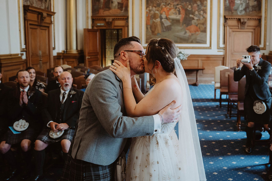 Couple kiss during their ceremony