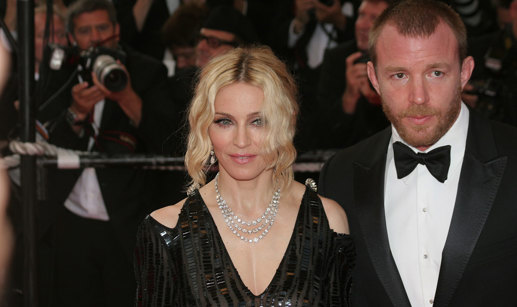madonna and guy ritchie pose for photograph on red carpet wearing black tie outfits