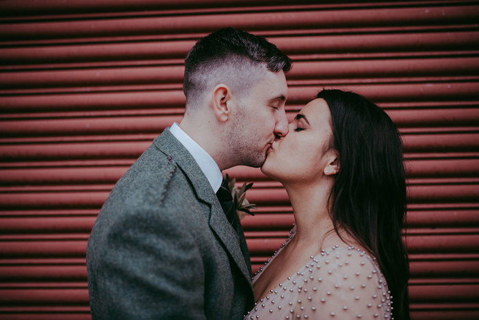 Bride and groom share a kiss