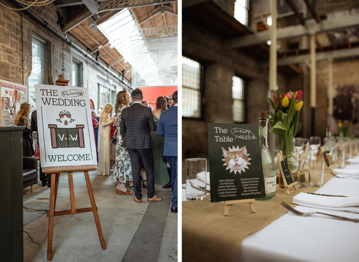 a wedding welcome sign on an easel as wedding guests mull around in background on left. A cat-themed wedding table sign sitting on a miniature easel on a hessian table runner with tulips in a vase and a gin bottle decoration on right