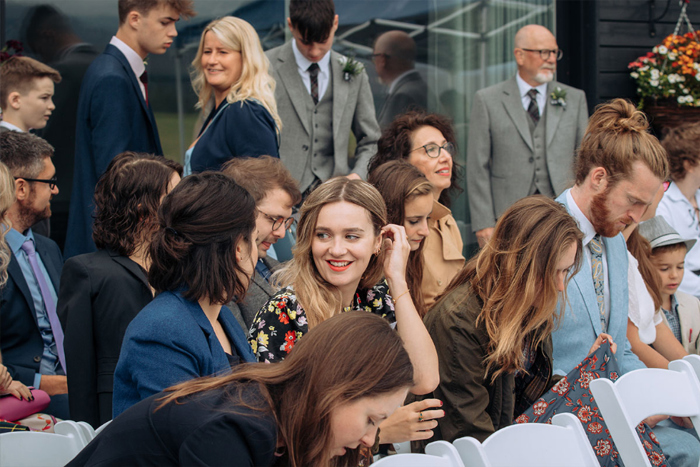 Wedding Guests Seated For A Wedding Ceremony Outdoors