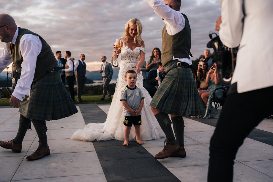 Bride and son on outdoor dancefloor