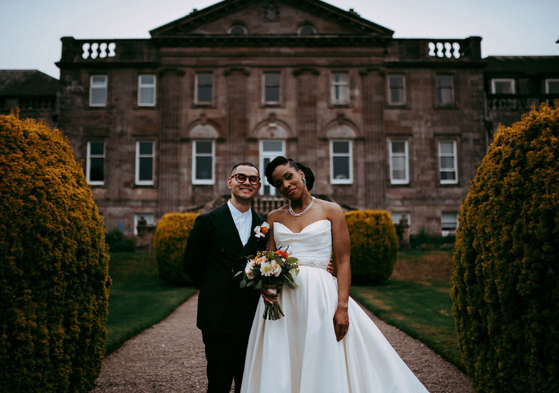 Bride and groom outside Springkell House