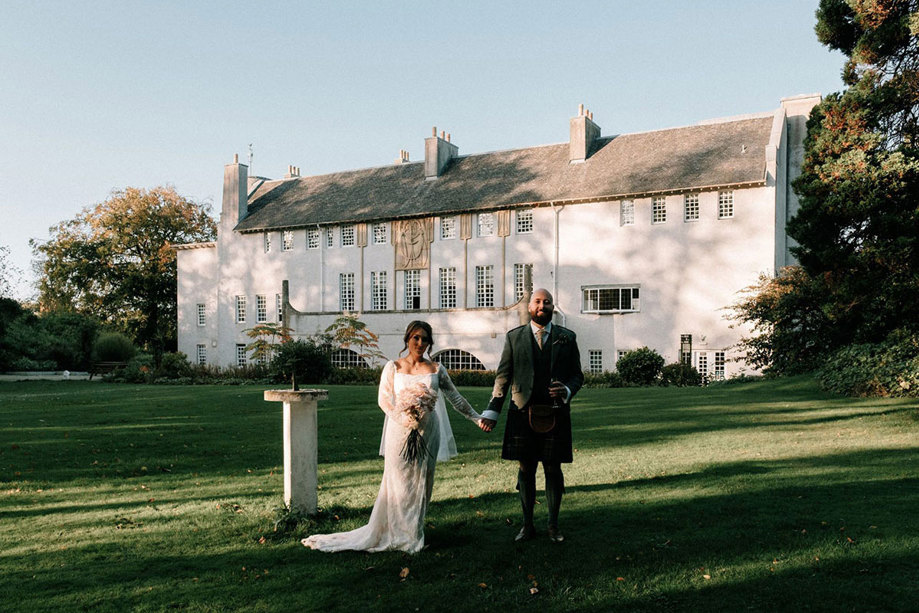 Bride and groom outside House For an Art Lover