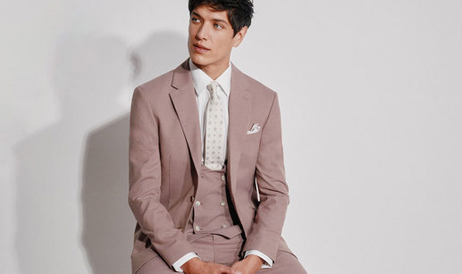 a person wearing a Moss mauve flannel suit