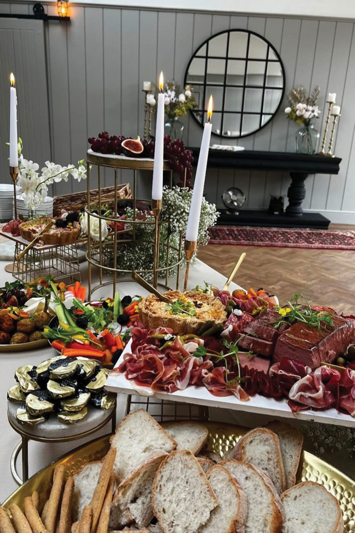 A table with a platter of food on it by Platter & Pop at Dunglass Estate