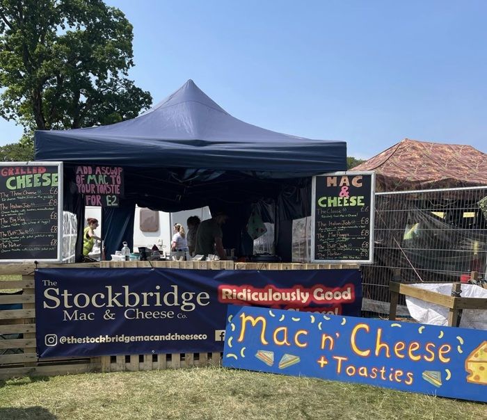 Food stall set up at food market with signage