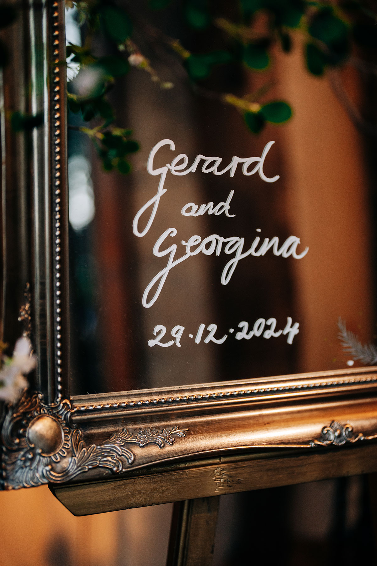 mirror with white writing for wedding sign at oran mor