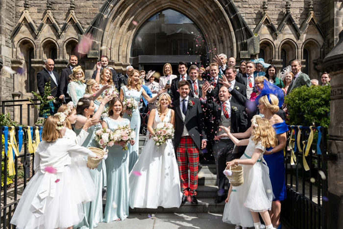 Confetti shot as couple walk out of the church