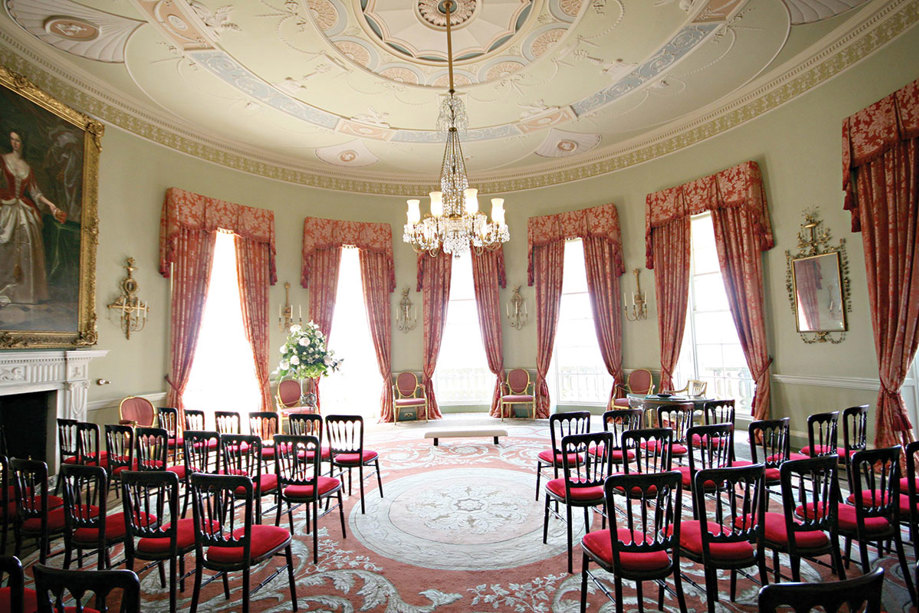 The round drawing room at Culzean Castle set with rows of chairs for a wedding ceremony