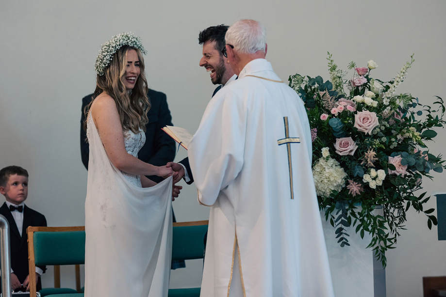 Couple laugh during the wedding ceremony