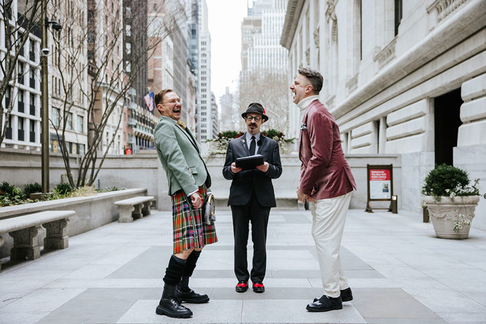 A group of men standing in a city