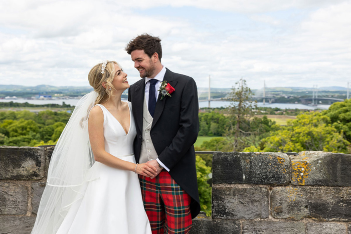 Outdoor couple portraits with scenic backdrop