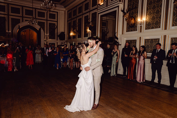 guests watch as bride and groom have first dance at drumtochty castle