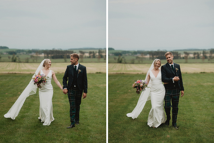 A Bride And Groom Walking On Grass