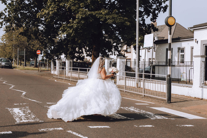 A Bride Walking Across A Zebra Crossing