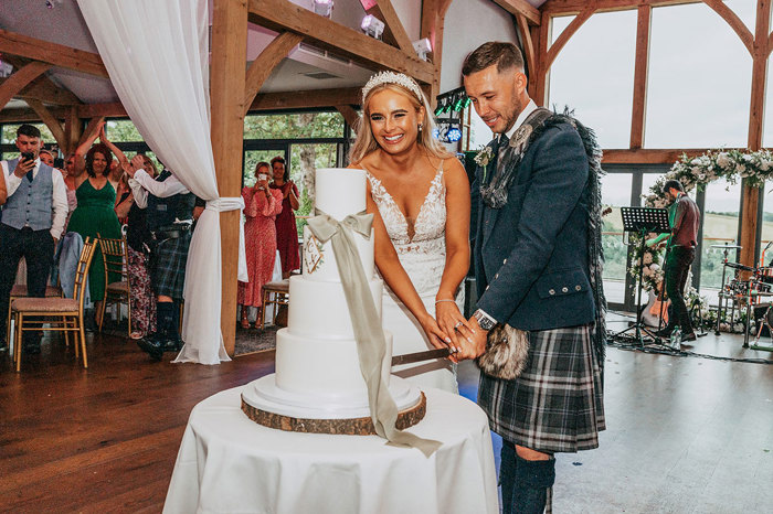 Bride And Groom Cutting Wedding Cake At Enterkine House