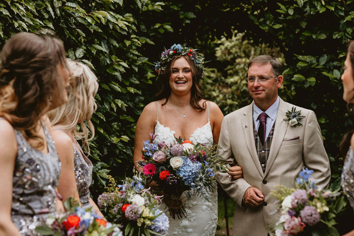 Bride and her father walk down the aisle