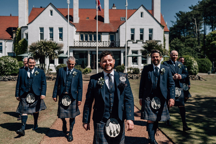 Men Wearing Macgregor And Macduff Kilts Walking Outside Lochgreen House