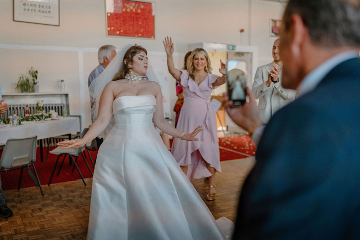 Bride dancing with guests at wedding reception at Garnethill Multicultural Centre Wedding