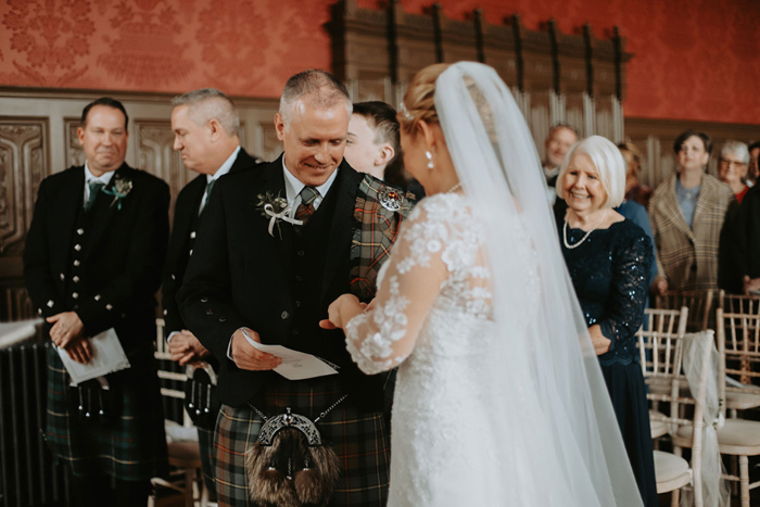 Couple exchange rings during the ceremony