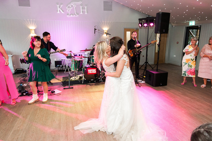 Brides dance on dancefloor