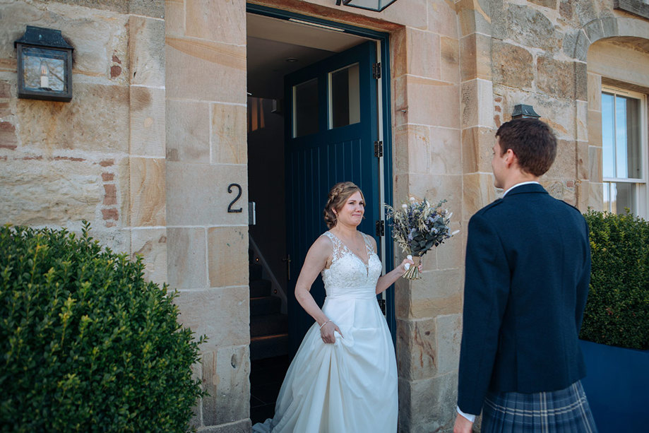 Bride crying as she sees her groom for the first time