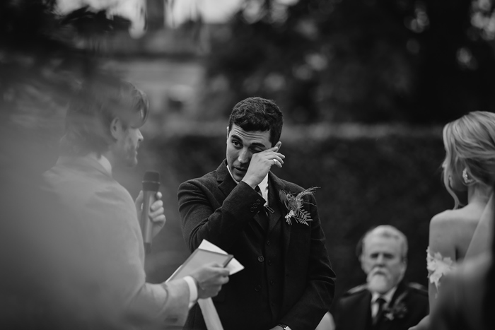 A Groom Wiping Away A Tear