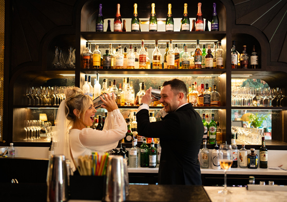 Bride And Groom Shaking Cocktails