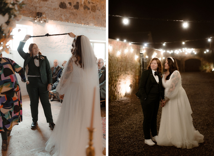 Two brides hold their hand fasting in the air during a wedding ceremony in a stone barn on left. Two brides pose under festoon lighting at nighttime with a rustic stone building in background