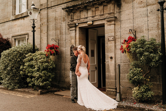 Couple portrait of brides outside the venue