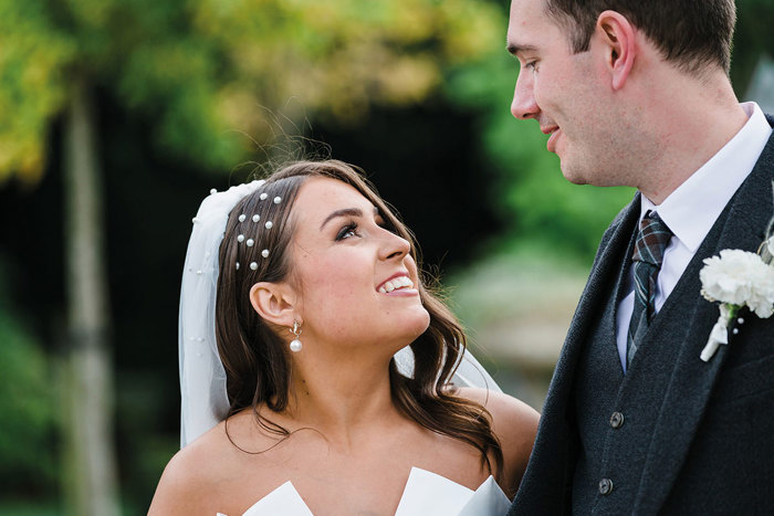 Bride and groom looking at each other