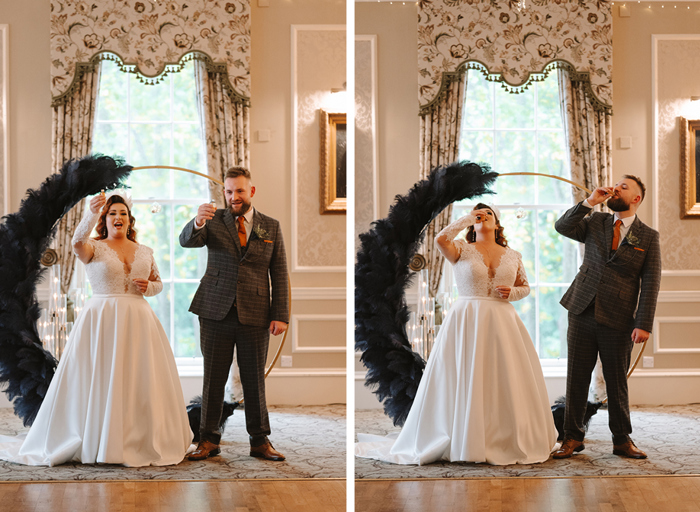 a bride and groom stand in front of a navy and gold moongate taking a shot