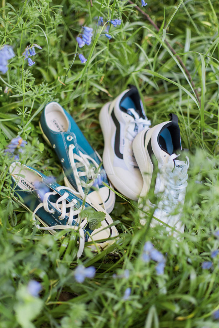 two pairs of trainers in grass