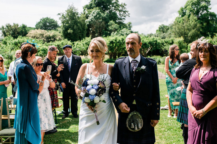 Bride walking down the aisle with her dad