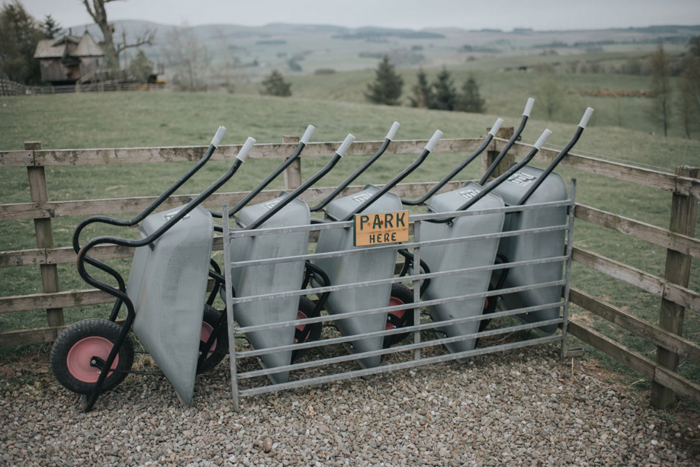 Wheelbarrows parked in a line