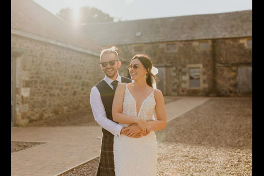 bride and groom wearing sunglasses