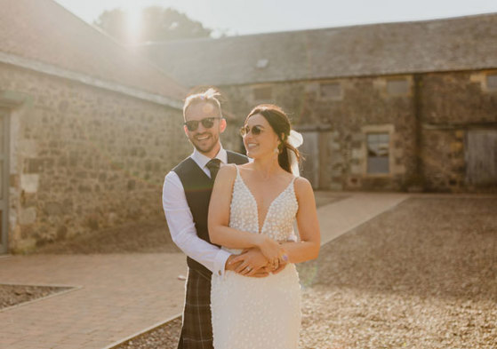 bride and groom wearing sunglasses