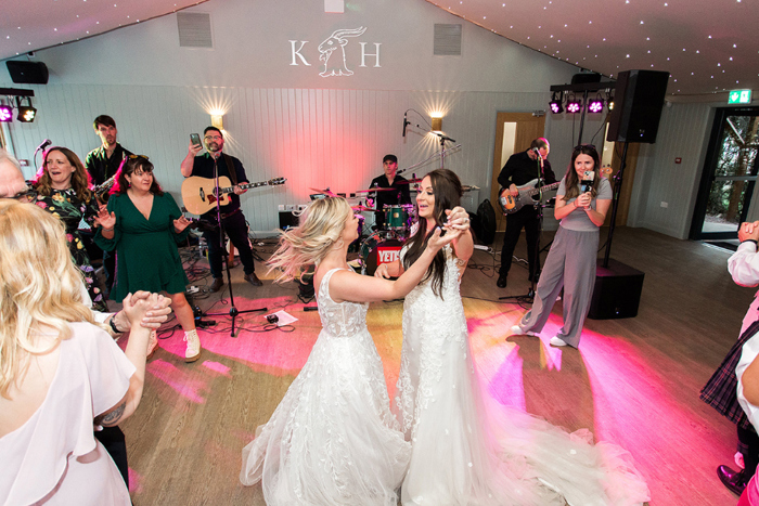 Brides dance on dancefloor