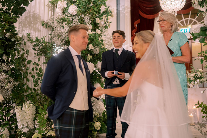 Bride and groom laugh during their wedding ceremony