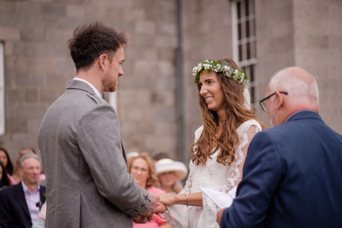 An Outdoor Wedding Ceremony Of A Bride And Groom At Raemoir House With Minister Howard Drysdale