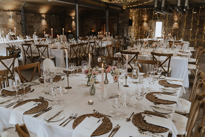 tables set with chairs, linen and place settings for falside mill wedding