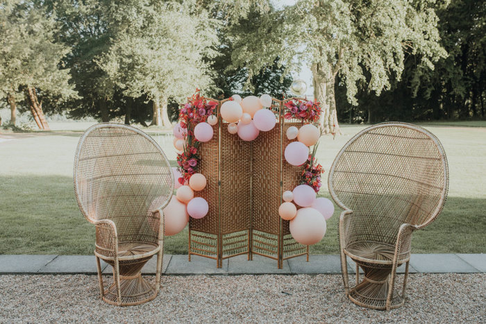 Peacock chairs and a balloon installation for one of Revelry Event’s couple’s pre-wedding celebrations (Photo: meganelle.co.uk)