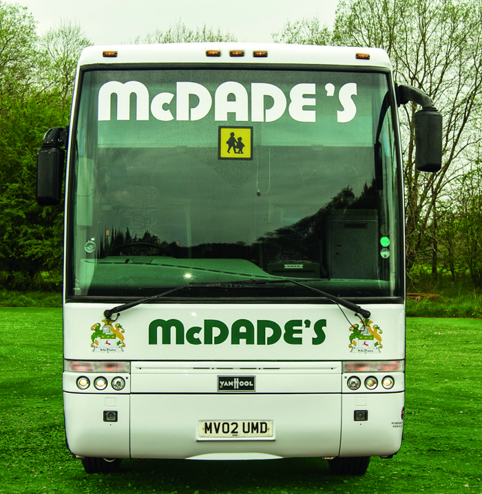 A McDade's coach from the front on grass