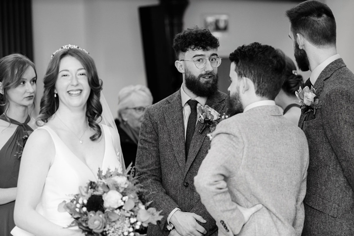 Black and white photo of couple and their guests